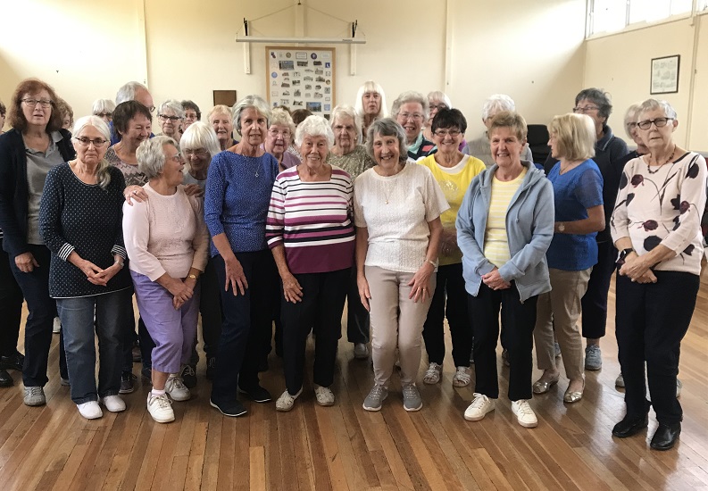 Picture showing retiring and new leaders with some group members.