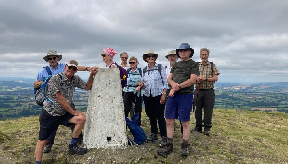 Challenge walkers at the summit of Tittenstone Clee