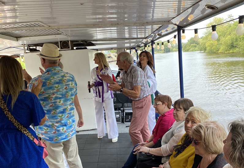 MOTO members on a boat trip down the River Severn, with ABBA tribute