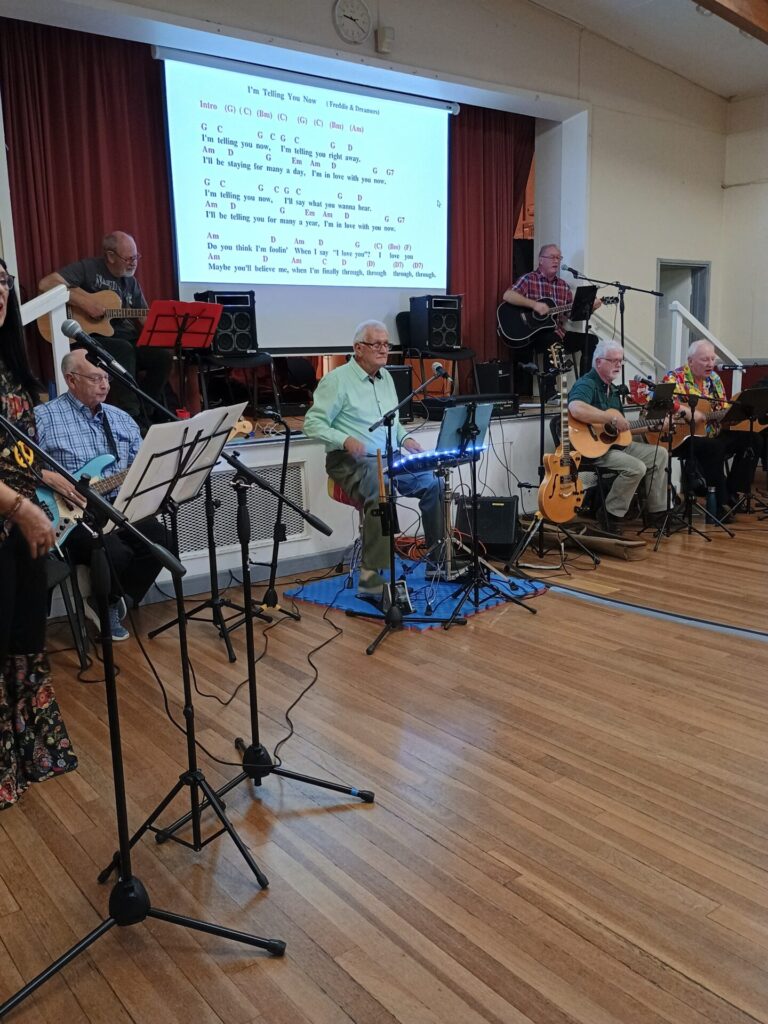 Guitarists leading the sing along with 'I'm Telling You Now'
