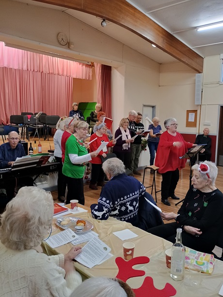 Singing for Fun group leading the singing at Christmas Party 2024