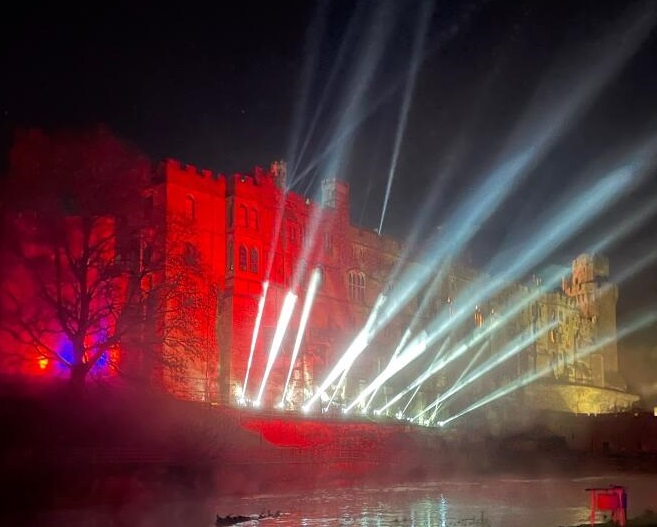 warwick castle with searchlights skyward