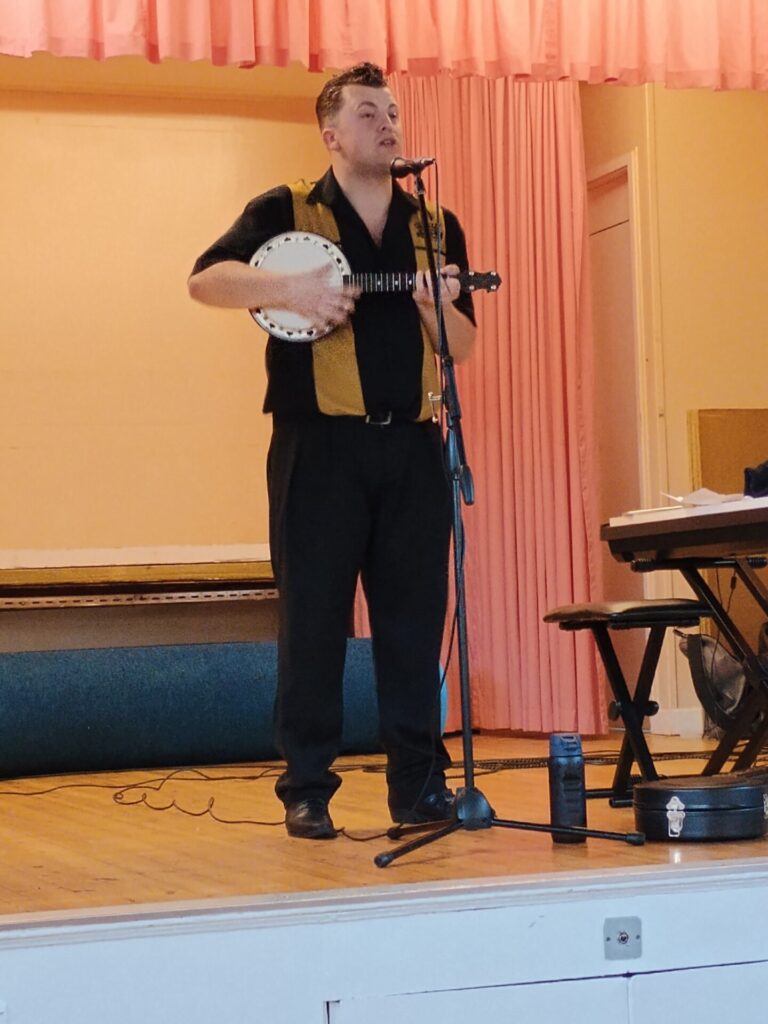 Joe James Thomas strums
